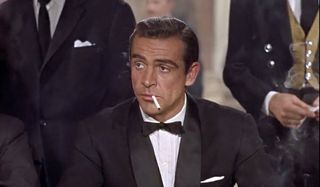Dr. No Sean Connery smokes casually playing Baccarat