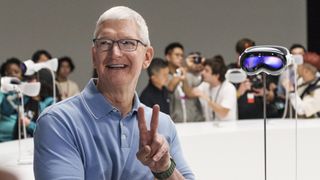 Tim Cook, chief executive officer of Apple Inc., beside an Apple Vision Pro mixed reality (XR) headset during the Apple Worldwide Developers Conference at Apple Park campus in Cupertino, California, US, on Monday, June 5, 2023. Apple Inc. will charge $3,499 for its long-awaited mixed-reality headset, testing whether consumers are ready to spend big bucks on a technology that the company sees as the future of computing. Photographer: Philip Pacheco/Bloomberg via Getty Images