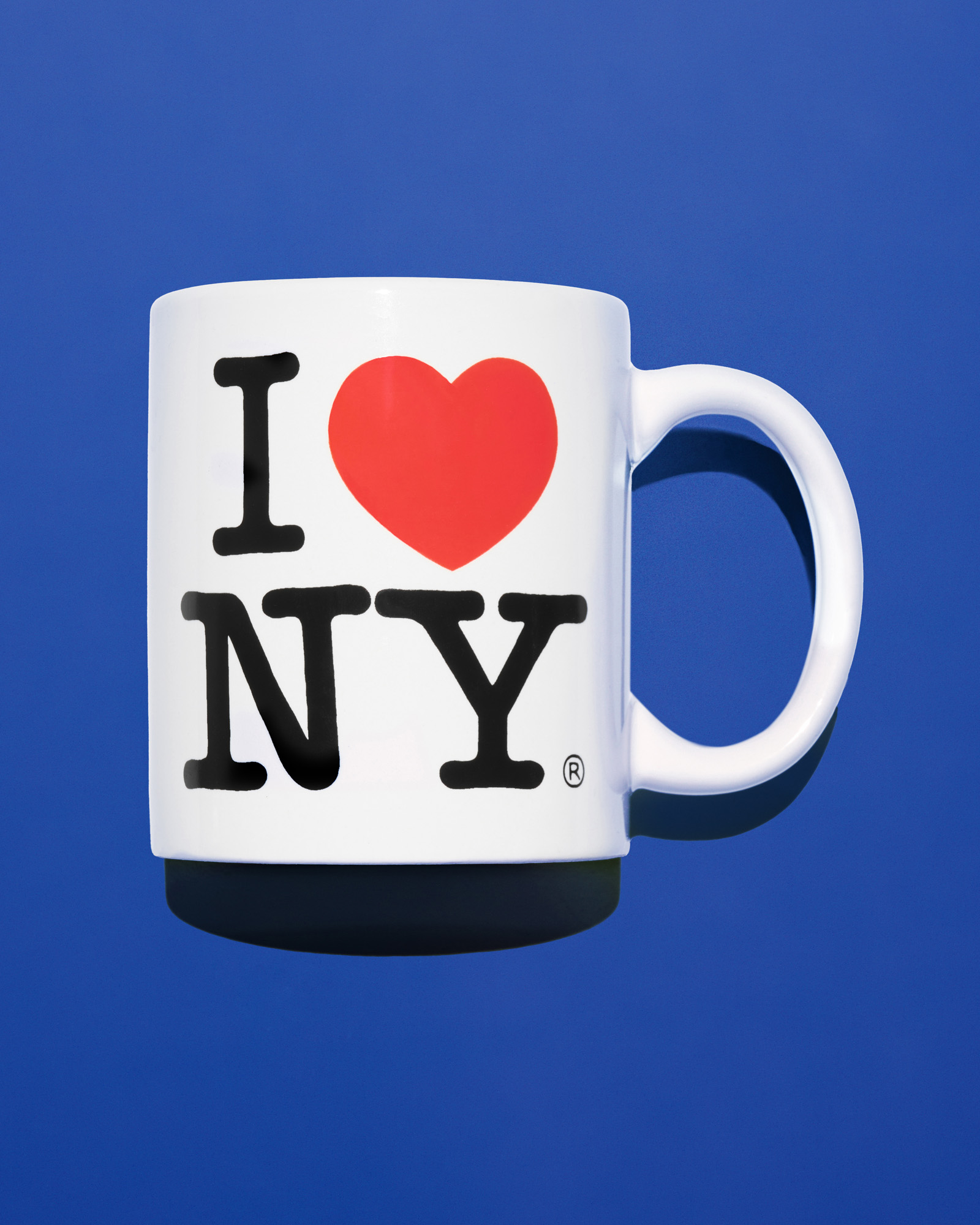 A white mug with the I Love New York logo by Milton Glaser
