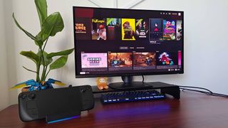 Razer Handheld Dock Chroma with Steam Deck attached and SteamOS main menu on screen.