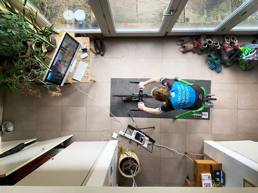 A view from above of a cyclist on an indoor trainer