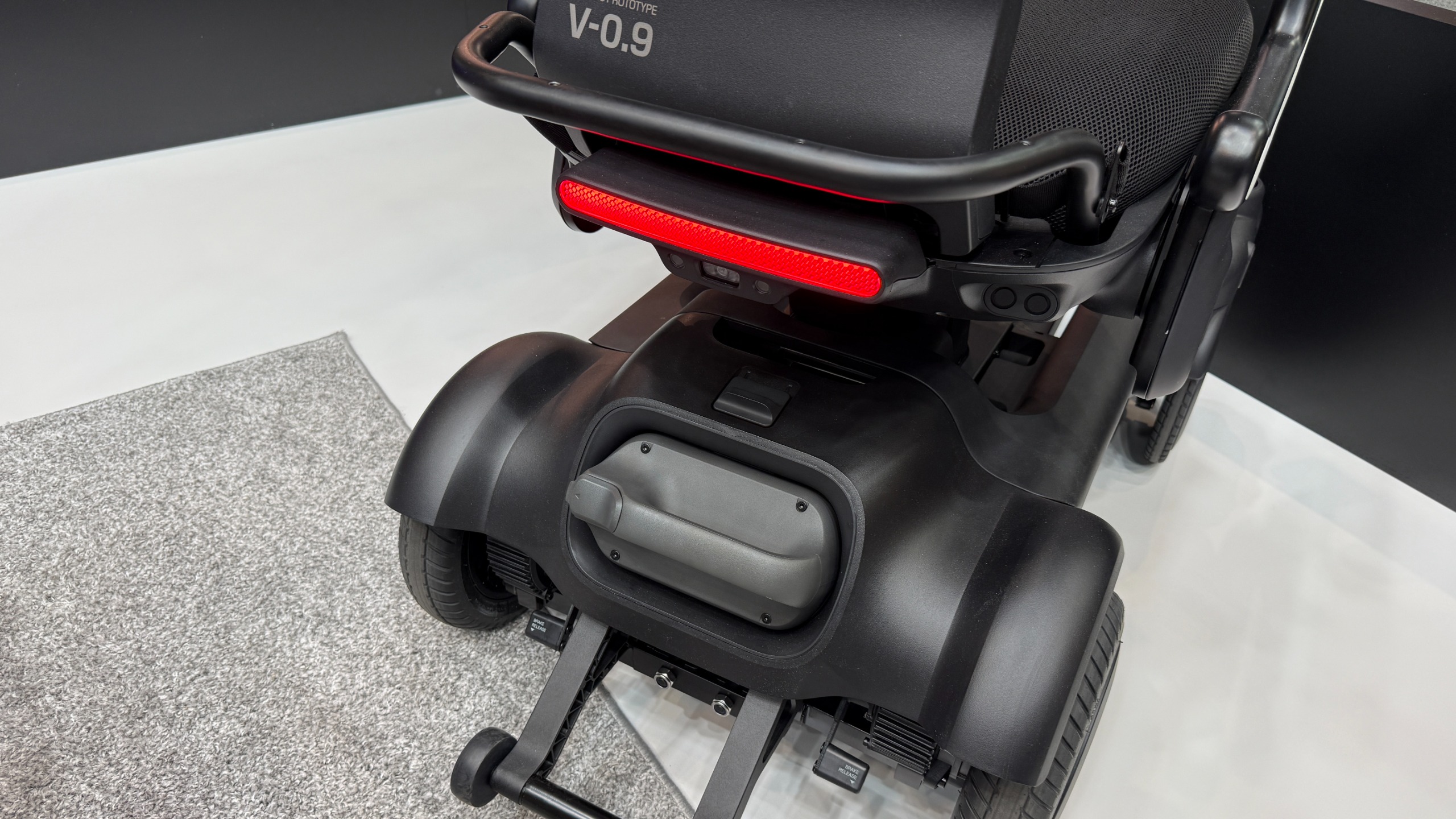 The Strutt ev1c's rear light and battery unit are visible