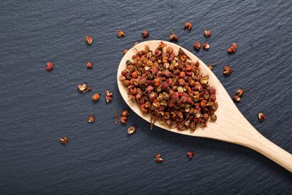 Wooden Spoon Full Of Szechuan Peppers