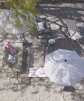 Summer umbrellas and chairs in a garden