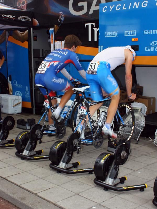 Garmin-Transitions riders are using the new LeMond Revolution trainers for pre-stage warmups and while they're seen atop front wheel riser blocks here, the rear axle of the trainer is situated so that the bike is level when the wheel is resting right on the ground.