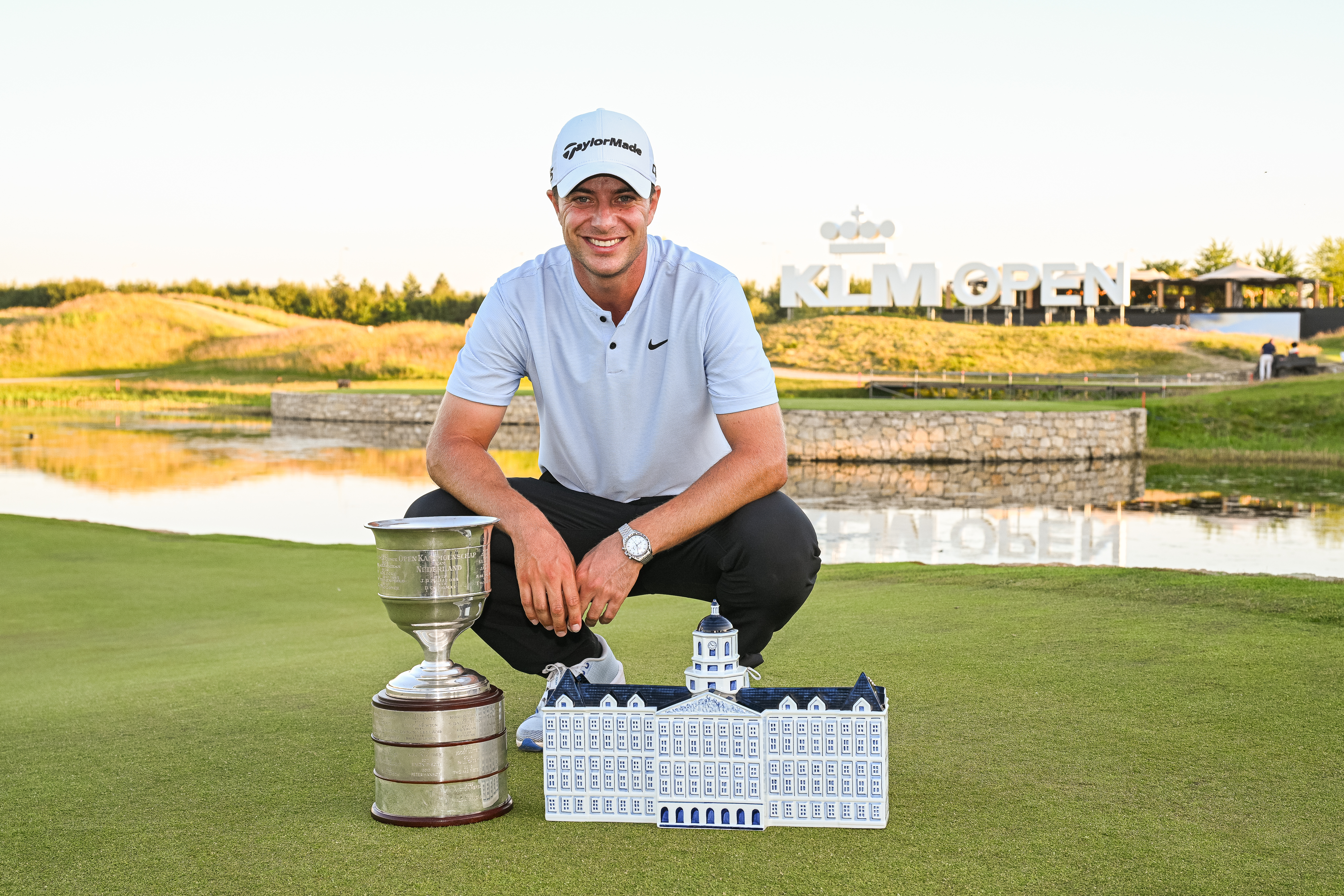 Guido Migliozzi poses next to the KLM Open trophy after winning at The International Golf Club in 2025