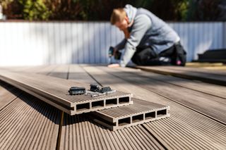 man installing decking