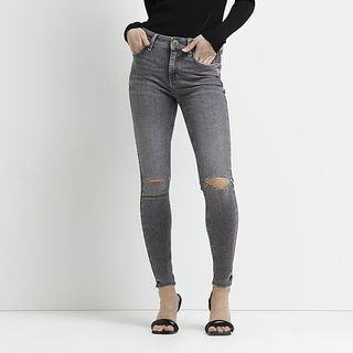 grey mid rise skinny jeans with rips