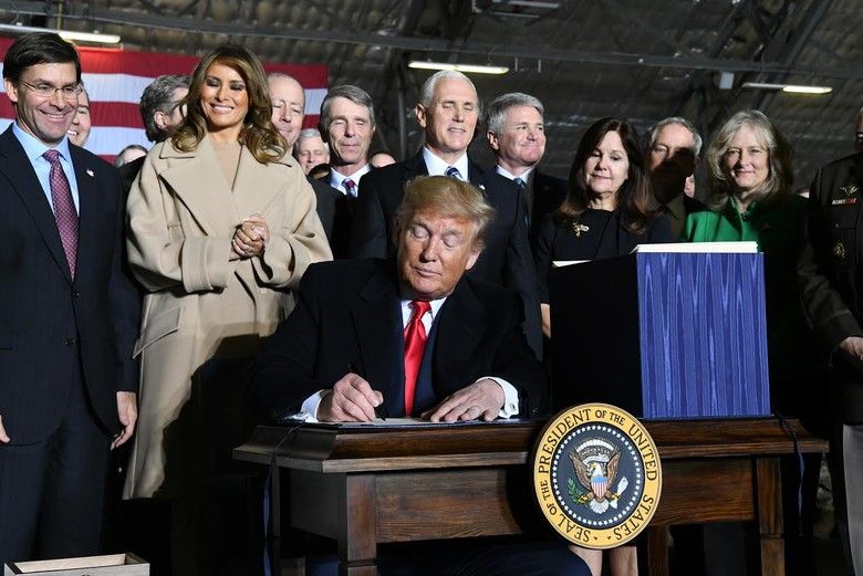 President Donald Trump signs S.1790, the National Defense Authorization Act for Fiscal Year 2020 on, Friday, Dec. 20, 2019 at Joint Base Andrews. The act directed the establishment of the U.S. Space Force as the sixth branch of the armed forces.