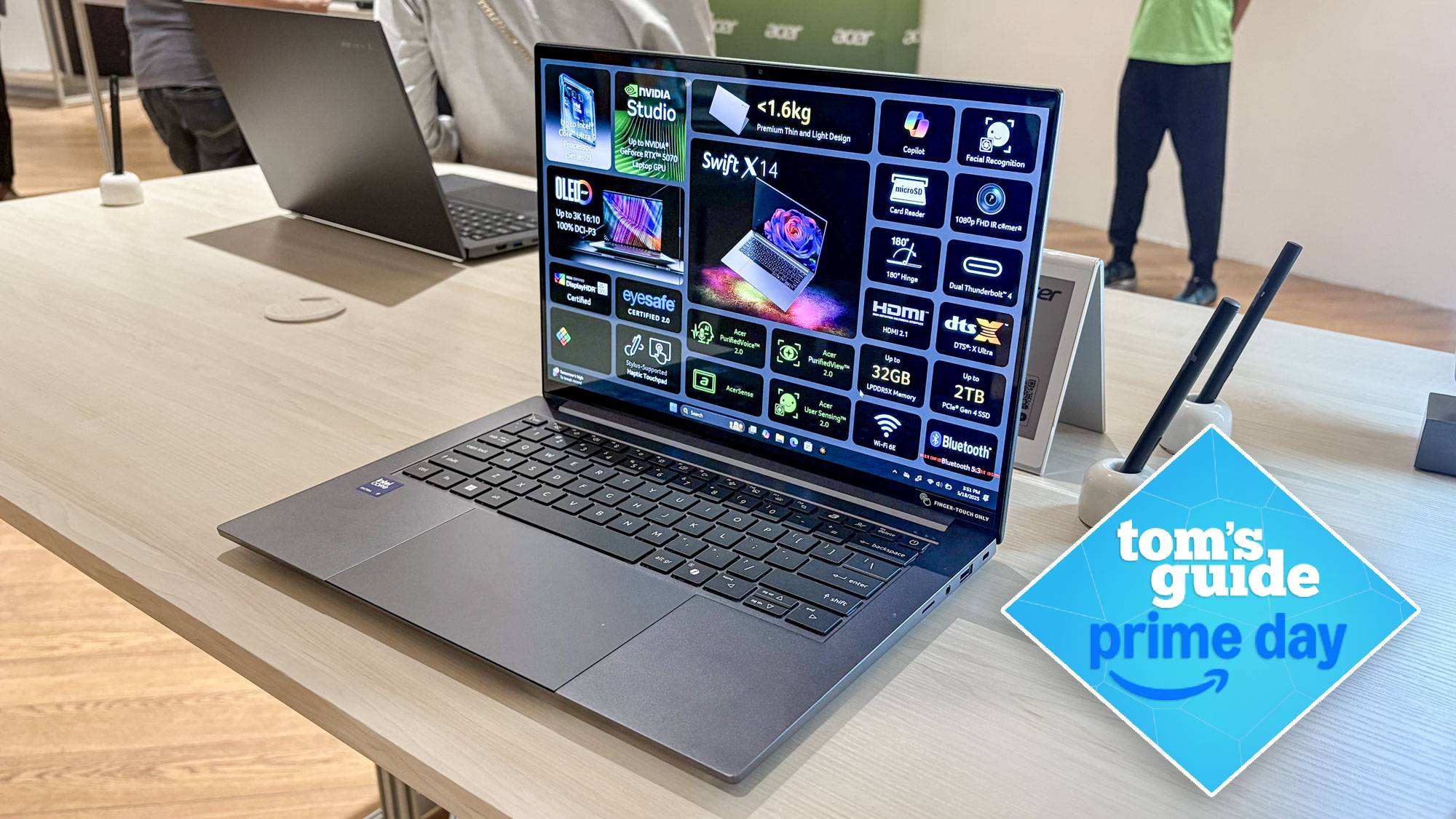 Acer Swift 14 X on table with Tom's Guide Prime Day badge