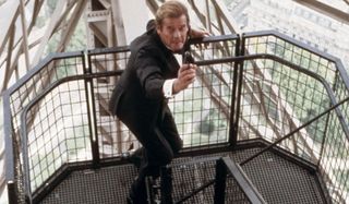 A View To A Kill Roger Moore aims his gun in a tuxedo
