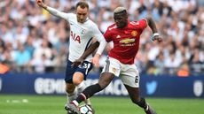 Tottenham Hotspur midfielder Christian Eriksen battles with Manchester United’s Paul Pogba