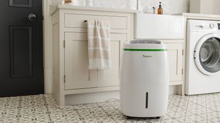 Meaco dehumidifier in white kitchen with patterned floor