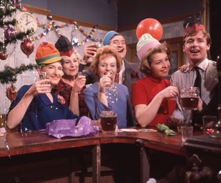 A Coronation Street Christmas in 1963... (From left to right) Eileen Derbyshire (as Emily Nugent), Betty Alberge (as Florrie Lindley), Doreen Keogh (as Concepta Hewitt), Ivan Beavis (as Harry Hewitt), Anne Reid (as Valerie Barlow) and William Roache (as Ken Barlow)