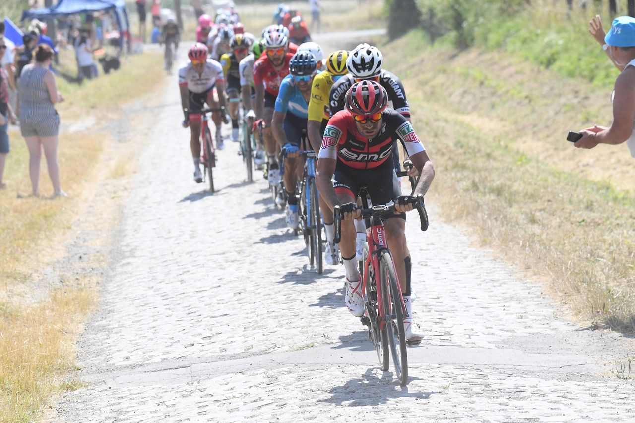 Damiano Caruso (BMC) leads the peloton over the pav&eacute;