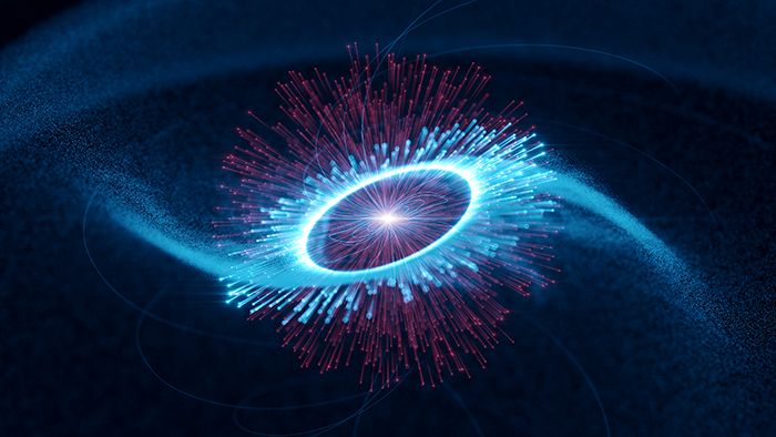 Artist&#039;s impression of the Vela pulsar, in the center, and its magnetosphere, whose edge is marked by the bright circle. The blue tracks travelling outwards represent paths of accelerated particles. These produce gamma radiation along the arms of a rotating spiral by colliding with infrared photons emitted in the magnetosphere (in red).