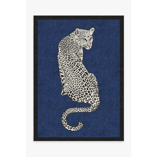 blue rug with a leopard on it