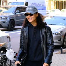 Tessa Thompson wearing an all-black outfit and burgundy loafers