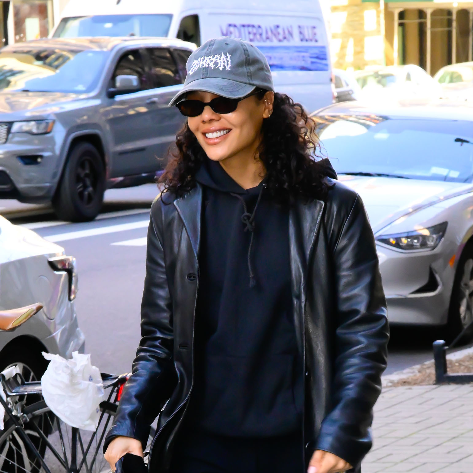 Tessa Thompson wearing an all-black outfit and burgundy loafers
