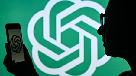 ChatGPT log with person in foreground.