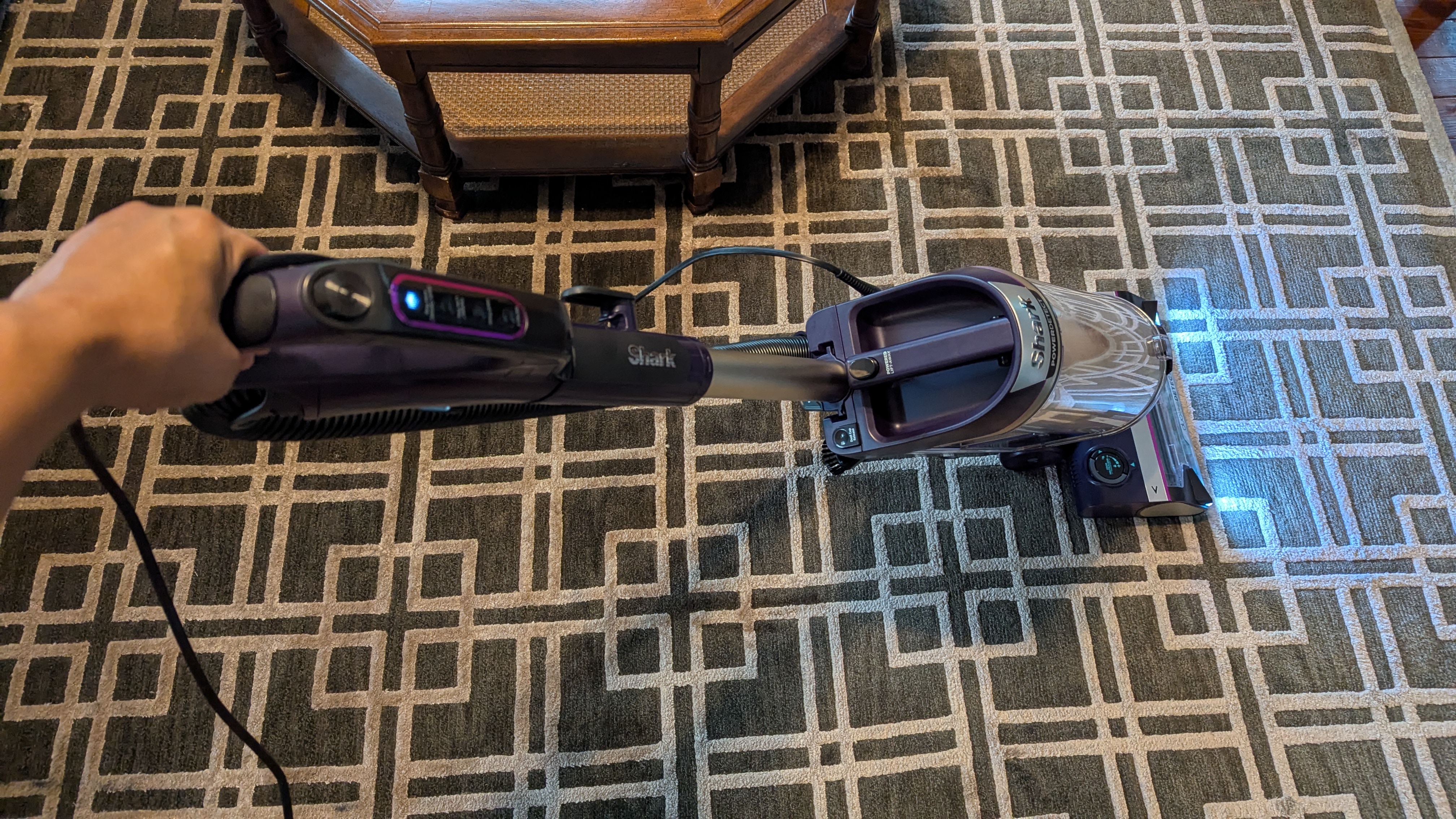 Shark PowerDetect Upright vacuum being used by reviewer in her home