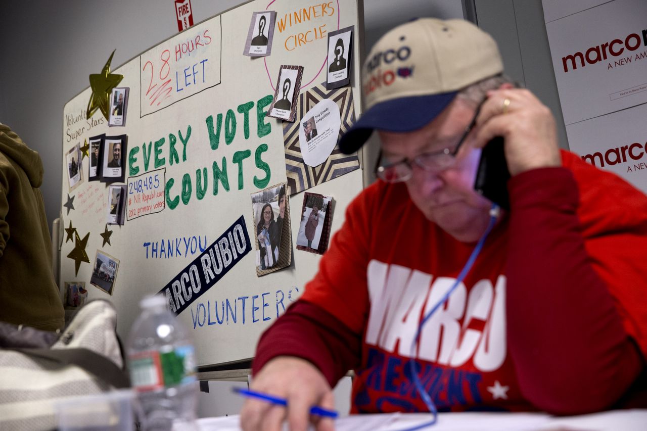 Marty Bove, of Londonderry, N.H., works the phone at a phone bank for Republican presidential candidate Sen. Marco Rubio, R-Fla., in Manchester, N.H., Monday Feb. 8, 2016.