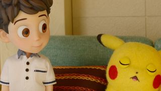 A still from Pokémon Concierge featuring a stop-motion young boy and a Pikachu