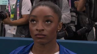 Simone Biles waits for her score in balance beam.