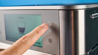 the fully automatic KF8 KitchenAid coffee machine is a stainless steel large coffee machine with a built-in grinder, milk frother, and espresso machine all in one with touchscreen controls