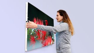 Displace TV woman hanging on wall 
