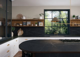 white cabinets with black marble worktops and wood shelves