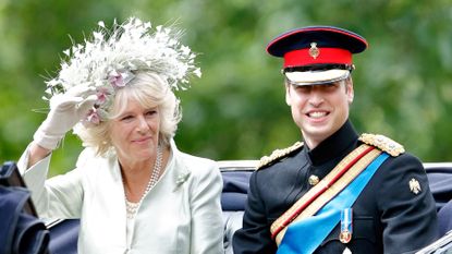 Camilla, Duchess of Cornwall and Prince William travel down The Mall in a horse drawn carriage during the annual Trooping the Colour Parade on June 14, 2008