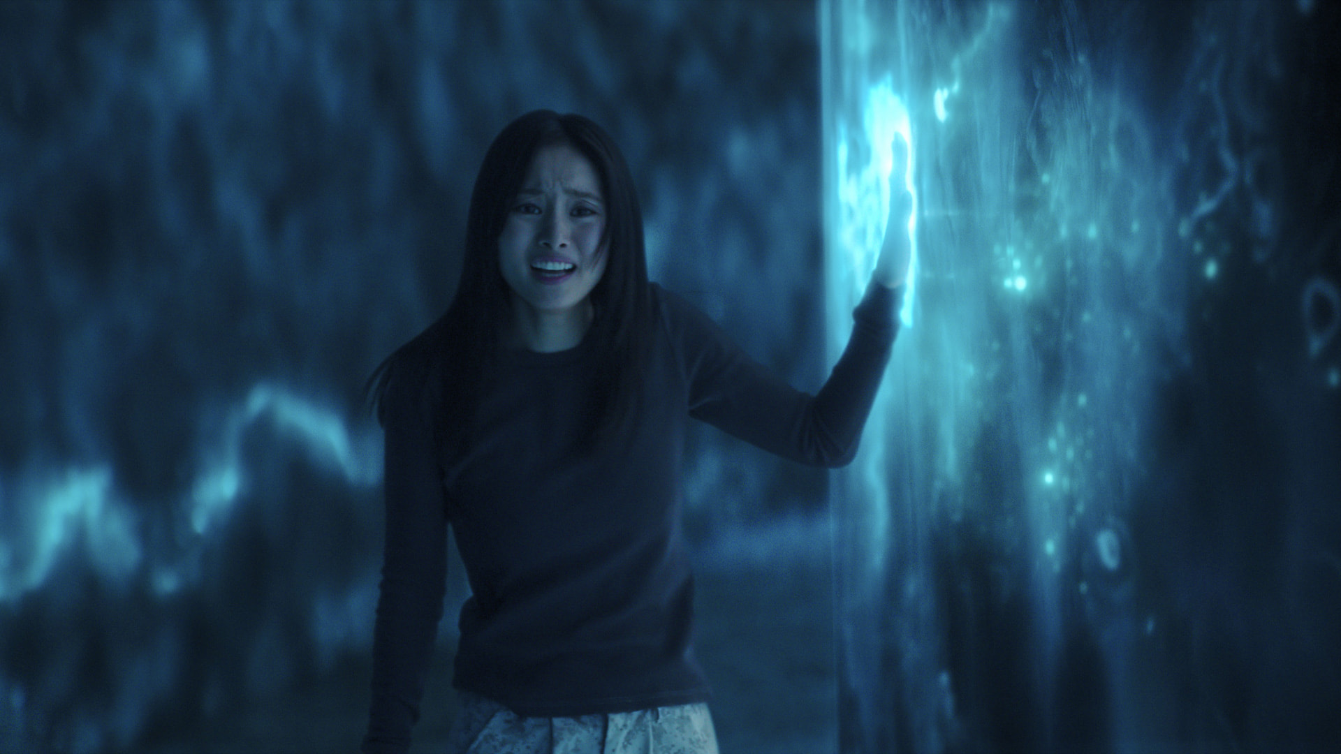 A woman in distress inside an alien spaceship