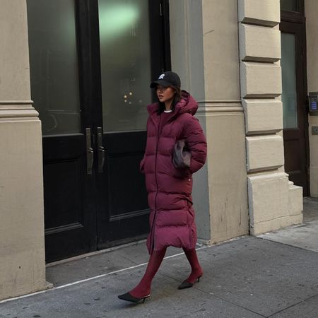 Fashion influencer @mimixn in New York City wearing a chic winter outfit styled with a puffer jacket.