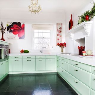 kitchen with mint colour cabinet