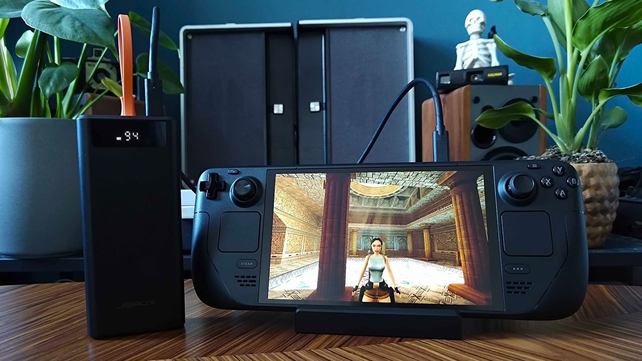 Jsaux 20000mah 65w power bank connected to Steam Deck with Tomb Raider Trilogy ganeplay on screen