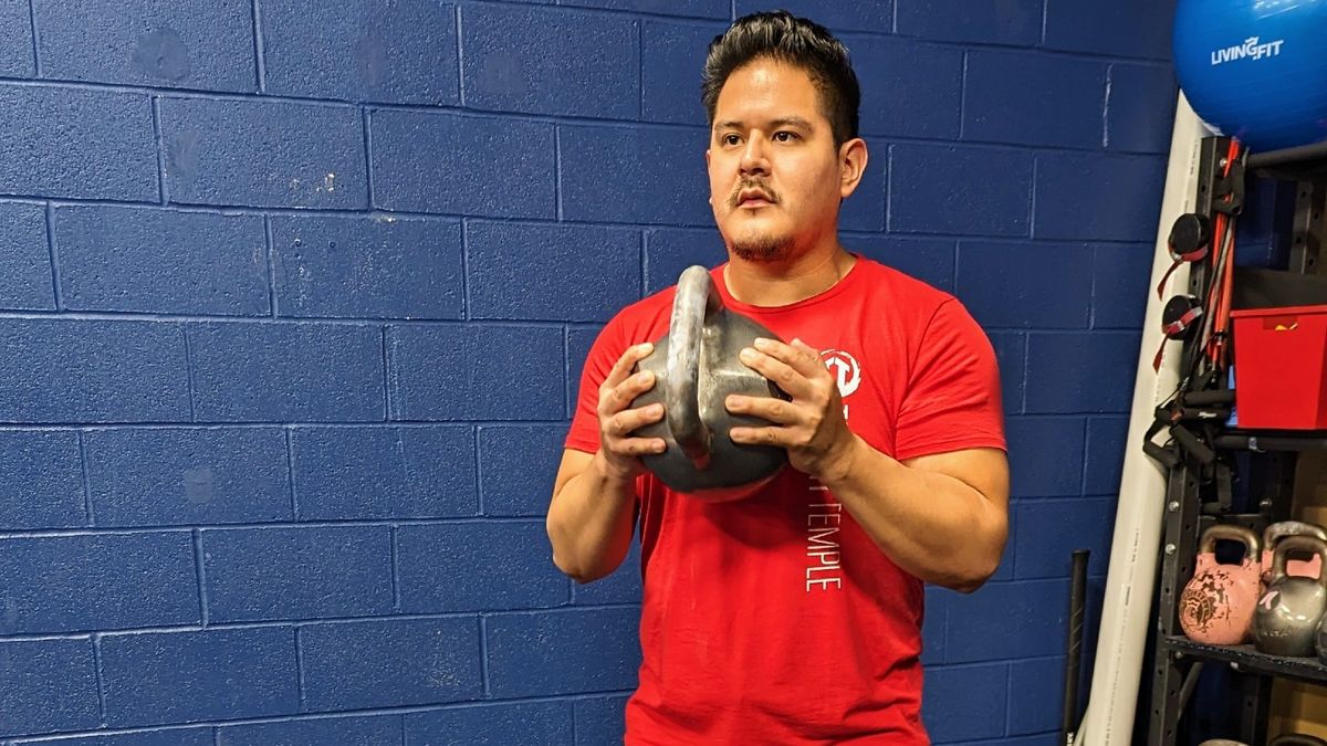 Gio Amatore performing the second phase of the crush grip curl