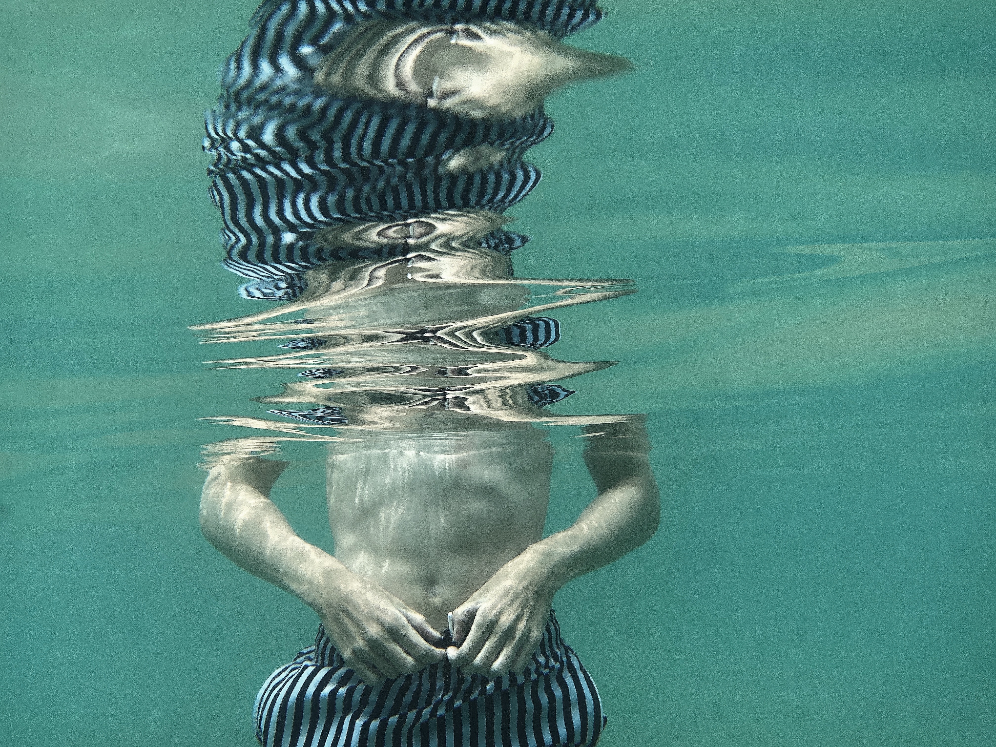 Underwater shot of a boy swimming