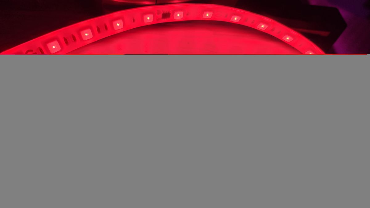 Govee Strip Light Pro 2 light strip set up on a gaming desk and around a drum set.
