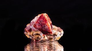 A red-gold colored zircon crystal.