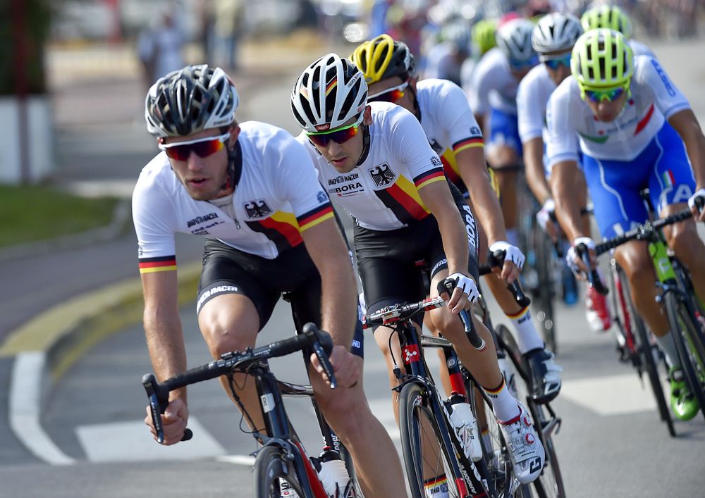The German riders line up at the front of the peloton