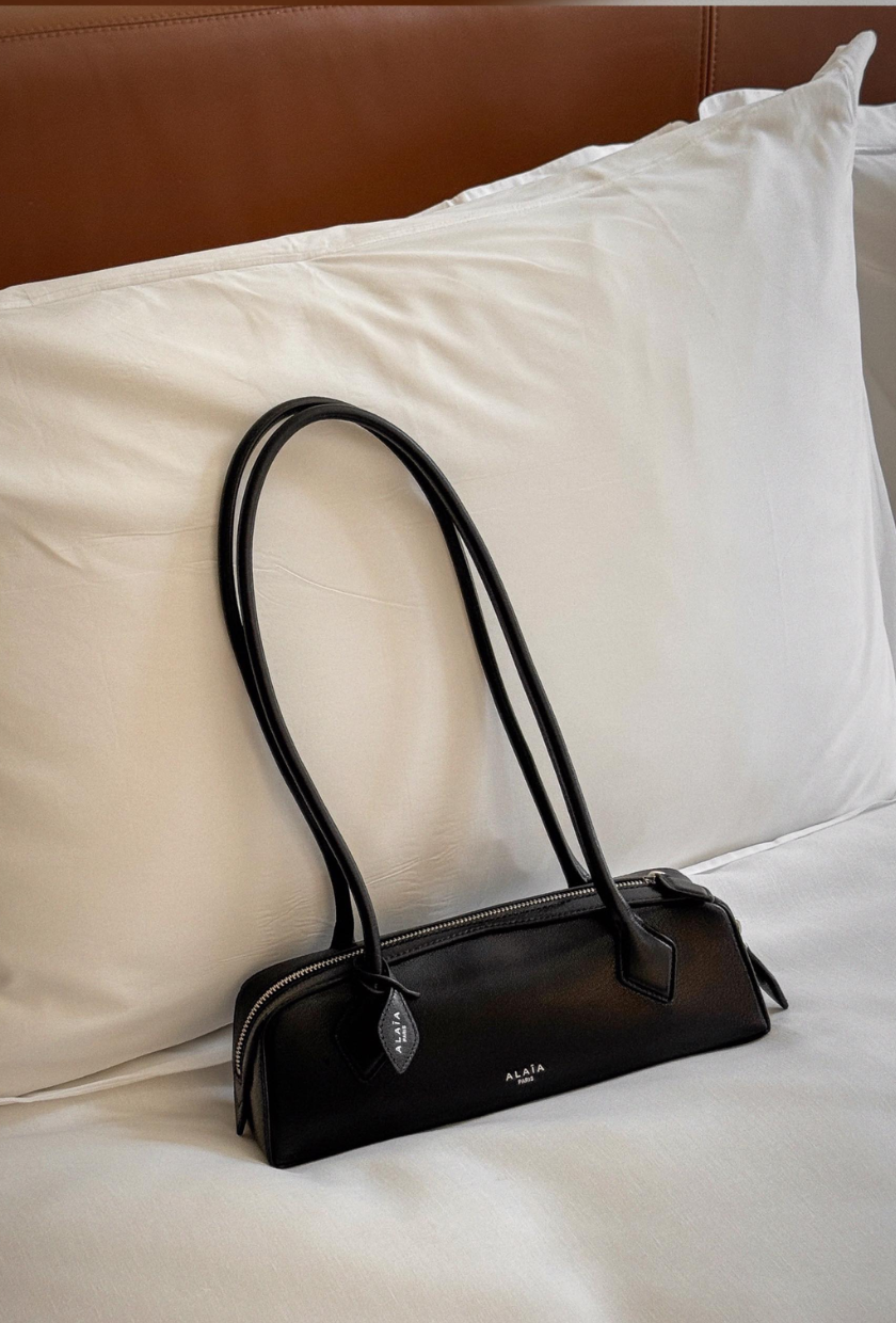 An image of @cassdimico carrying one of the most popular designer handbags.