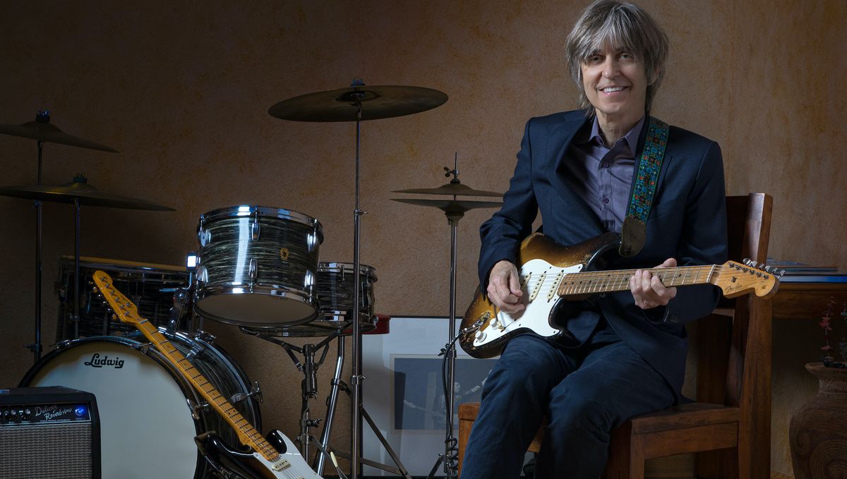 Eric Johnson holds his signature Fender Stratocaster