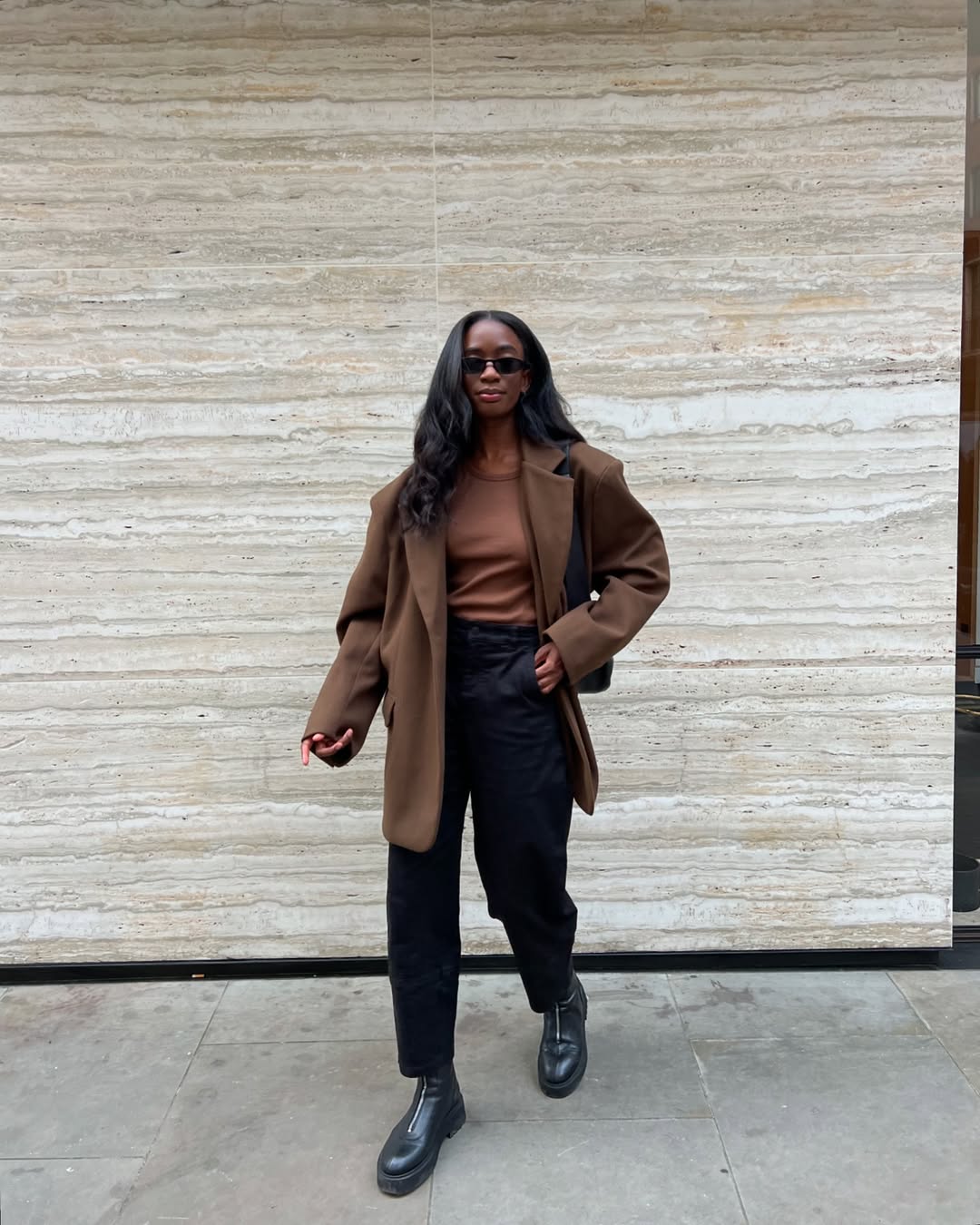 Liv wearing an oversized blazer, jeans and ankle boots