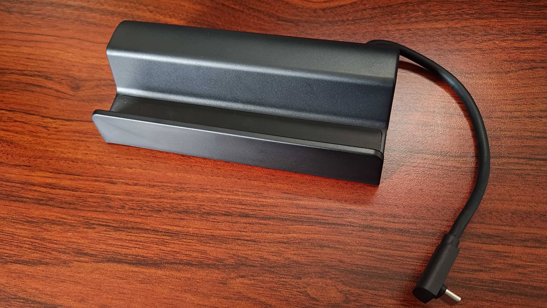 Front view of Antank Steam Deck dock on woodgrain desk.