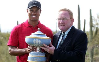 Tiger Woods is presented with the 2008 World Matchplay trophy after defeating Stewart Cink in the final