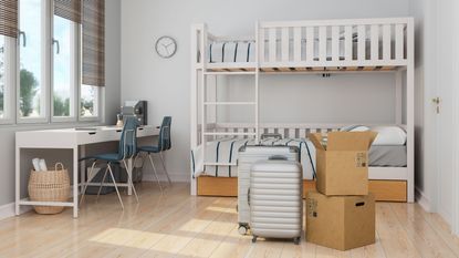 Dorm room with suitcases and boxes moved in 