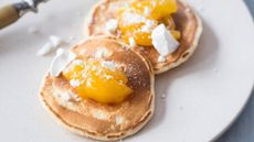lemon pancakes topped with lemon curd and crushed meringue