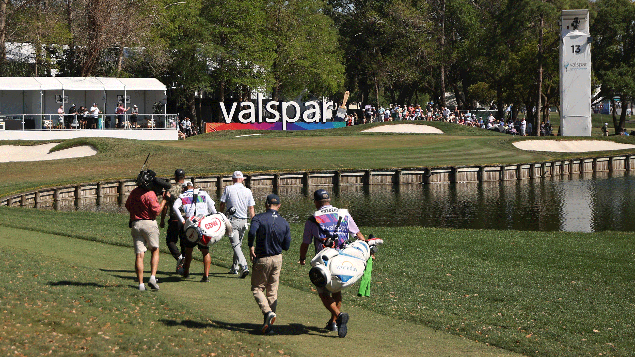 Players walk towards the 13th green on the Copperhead Course during the 2026 Valspar Championship