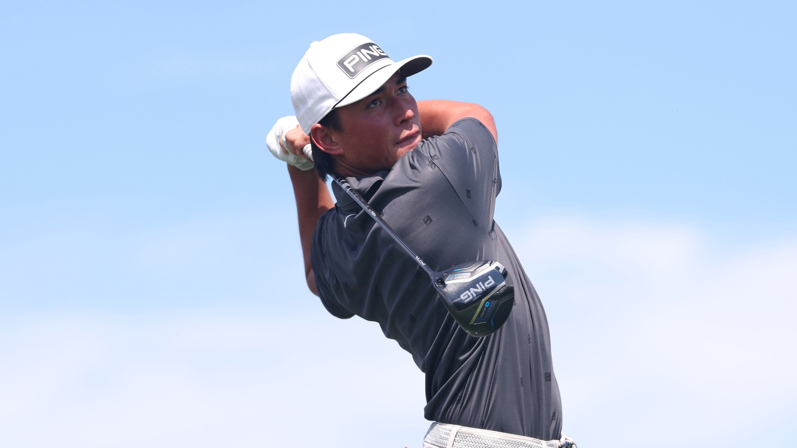 Kihei Akina hits a driver off the tee